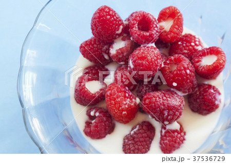 Raspberries with Milk in a Glass Bowl; From Above 37536729