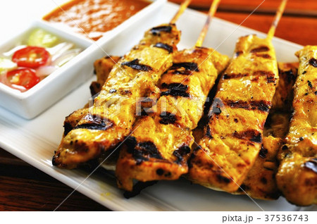 Grilled chicken sate kebabs with dips 37536743