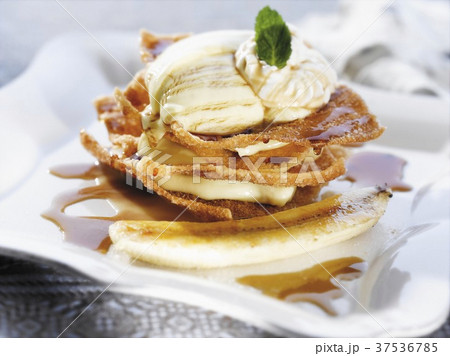 Banana Foster Pudding with Caramel Sauce and a Mint Leaf Garnish 37536785