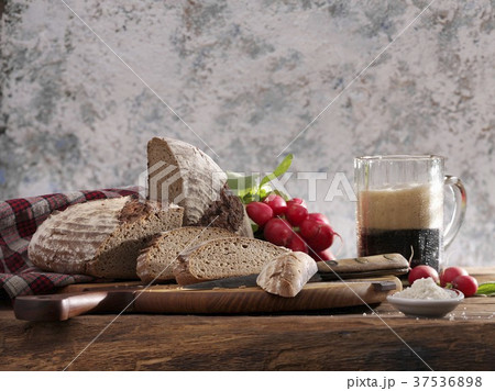 Rye bread made with dark beer, sliced on wooden board Rye bread made with dark beer, sliced on wooden board 37536898