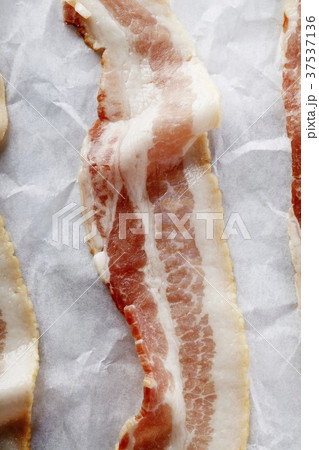 Bacon Strips on Parchment Paper; From Above Bacon Strips on Parchment Paper; From Above 37537136