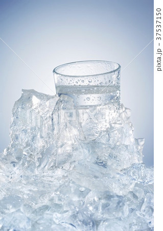 Water glass in a block of ice 37537150