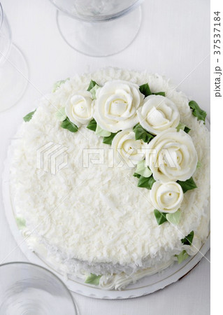 Vanilla Coconut Wedding Cake with White Frosting Flowers; From Above Vanilla Coconut Wedding Cake with White Frosting Flowers; From Above 37537184