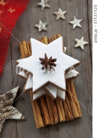 A stack of cinnamon stars with Christmas decorations 37537520
