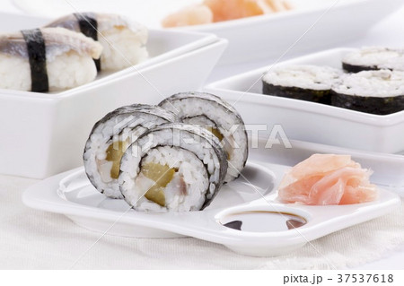Maki and nigiri sushi with herring and gherkins Maki and nigiri sushi with herring and gherkins 37537618