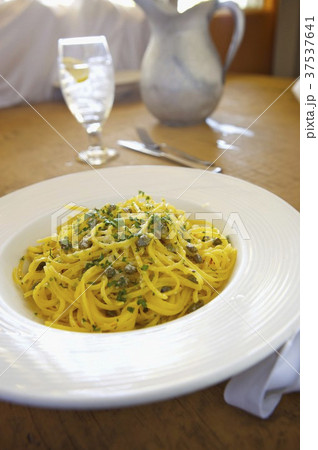 Spaghetti with Capers in a Butter Garlic Sauce; In a White Bowl 37537641