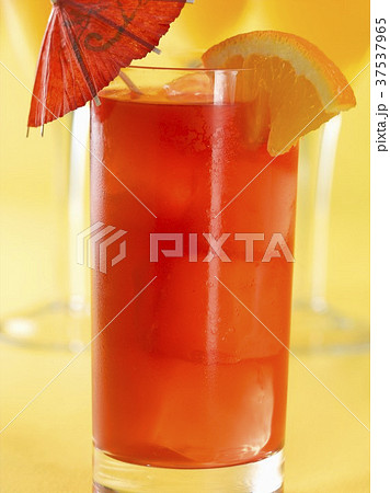 Singapore Sling Cocktail with Orange Wedge Garnish and Cocktail Umbrella 37537965