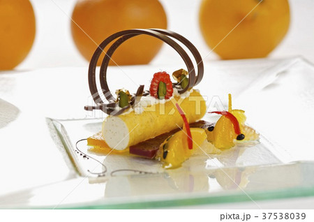 Quark mousse in saffron cannelloni with citrus fruit ragout Quark mousse in saffron cannelloni with citrus fruit ragout 37538039