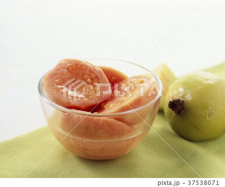 Canned Guava in a Glass Bowl; Fresh Guava Canned Guava in a Glass Bowl; Fresh Guava 37538071