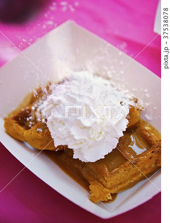 Peanut Butter Maple Waffles with Whipped Cream and Powdered Sugar Sprinkling On the Top 37538078