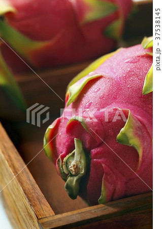 Whole Dragon Fruit in a Wooden Box; Close Up Whole Dragon Fruit in a Wooden Box; Close Up 37538145