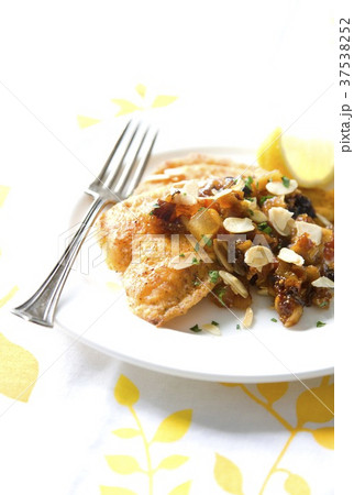 Baked fillet of fish with dried fruit compote 37538252