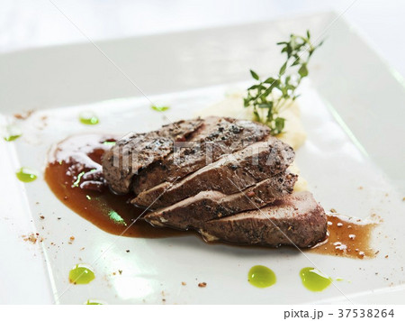 Pepper Crusted Peking Duck Breast with Pine Nut Polenta and Tasso Fig Port Wine Sauce Pepper Crusted Peking Duck Breast with Pine Nut Polenta and Tasso Fig Port Wine Sauce 37538264