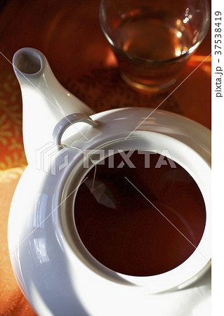 A fruit tea bag in a teapot A fruit tea bag in a teapot 37538419
