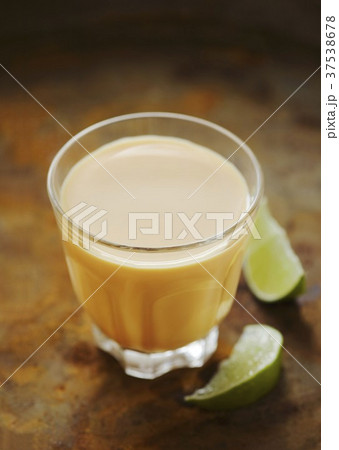 A glass of mango lassi (mango yogurt drink) 37538678