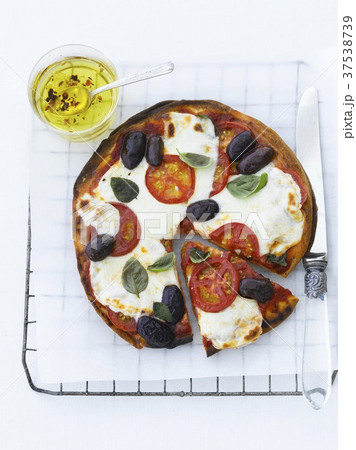Tomato, Olive Basil Pizza; One Slice Partially Removed; From Above 37538739