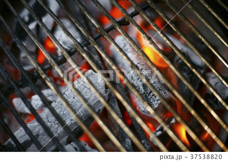 Hardwood Charcoal Burning in a Grill 37538820