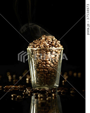 A glass of roasted coffee beans A glass of roasted coffee beans 37538973