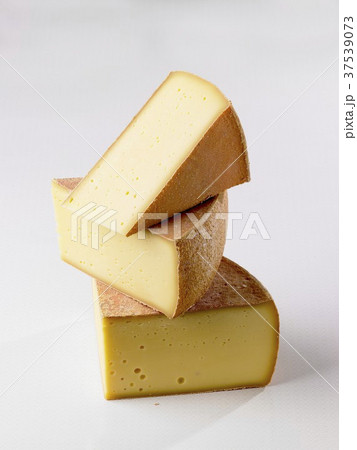 Three slices of mountain cheese Three slices of mountain cheese 37539073