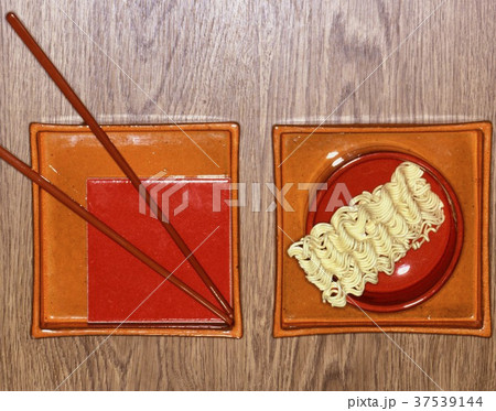 An oriental place setting with noodles An oriental place setting with noodles 37539144