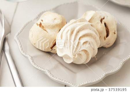 Three Meringues on a White Dish Three Meringues on a White Dish 37539195