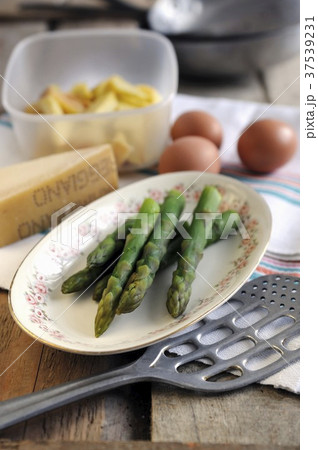 Ingredients for asparagus frittata with potatoes and Parmesan 37539231