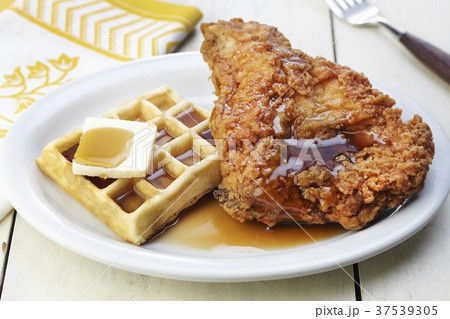 A Waffle and Fried Chicken with Maple Syrup and Butter A Waffle and Fried Chicken with Maple Syrup and Butter 37539305