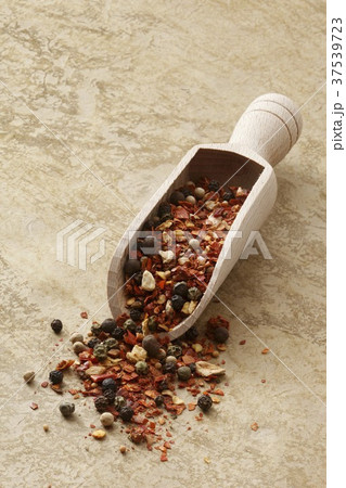 Mexican spice mixture in a wooden scoop Mexican spice mixture in a wooden scoop 37539723