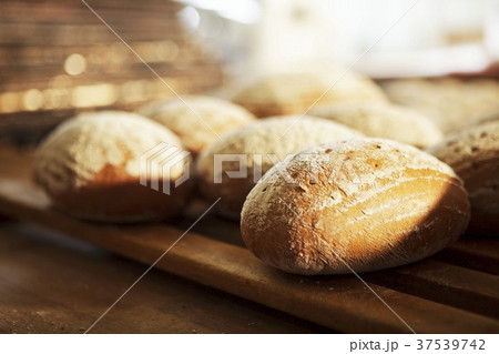 Bread rolls on a wooden rack Bread rolls on a wooden rack 37539742