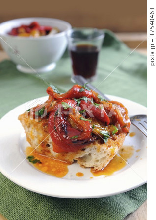 Sweet red and yellow peppers in a spicy chili sauce on a bruschetta 37540463