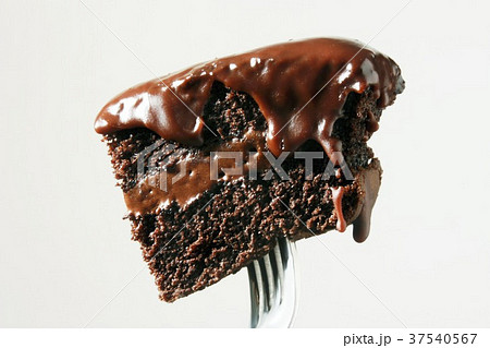 Piece of Chocolate Cake with Chocolate Frosting on a Fork 37540567