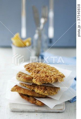 Schntizel Stacked with Parchment Paper Separating Them Schntizel Stacked with Parchment Paper Separating Them 37540838