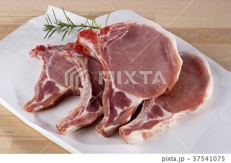 Raw pork chop in butcher paper Raw pork chop in butcher paper 37541075