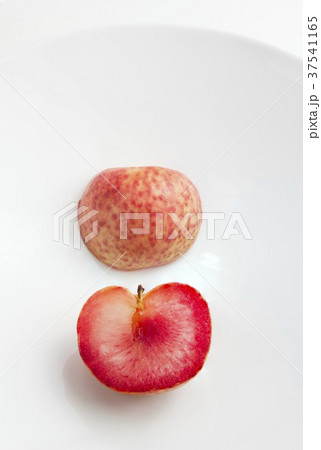 Halved Pluot; Showing the Outside and Inside of the Fruit 37541165