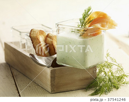Cold cucumber soup with smoked salmon and toasted bread 37541246