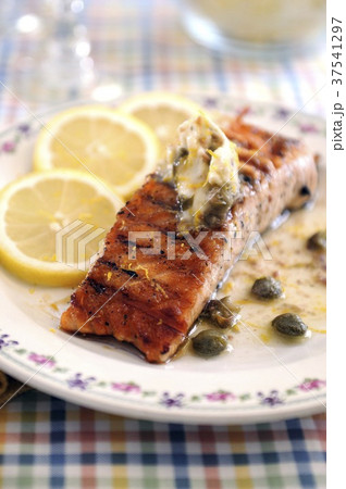 Fried salmon fillet with anchovies and caper butter Fried salmon fillet with anchovies and caper butter 37541297