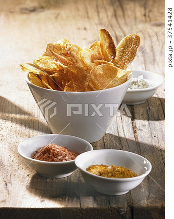 Potato chips with pepper salt, curry salt and celery salt 37541428