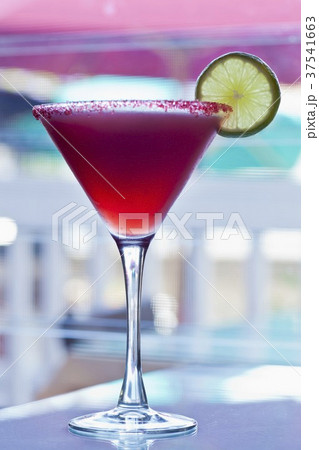 Hibiscus Infused Tequila Margarita with Sugared Rim and Lime Garnish 37541663