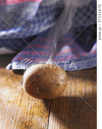 A whole steaming new potato 37541679