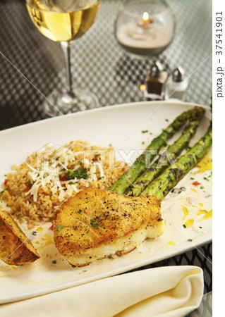 Sauteed Sea Bass with Asparagus, Rice and a Glass of Wine 37541901