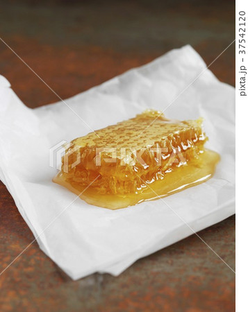 A honeycomb with honey A honeycomb with honey 37542120