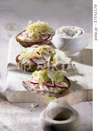 Brown bread topped with dripping and pointed cabbage salad Brown bread topped with dripping and pointed cabbage salad 37542179