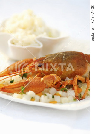 Cray fish on a bed of diced vegetables with a side of rice (Romania) 37542200