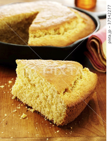 Slice of Corn Bread Cooked in a Cast Iron Skillet 37542277