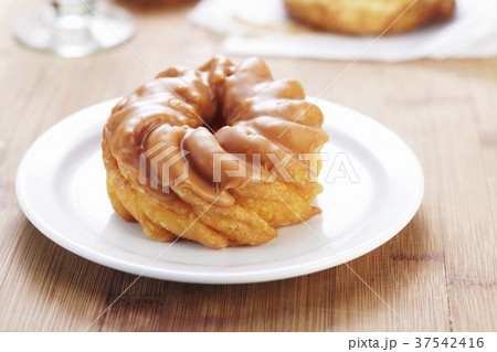 Maple Frosted Doughnuts on a White Plate 37542416