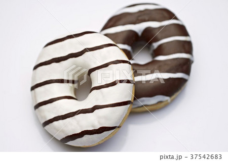 Two black and white doughnuts Two black and white doughnuts 37542683