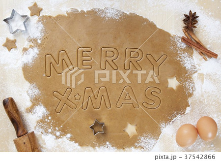 Cookie Dough Rolled Out with Merry X-Mas Cut Into It 37542866