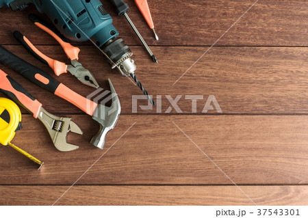 Set of work tools on wooden background Set of work tools on wooden background 37543301
