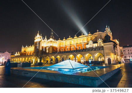 Cloth Hall building and fountain at night  37549627
