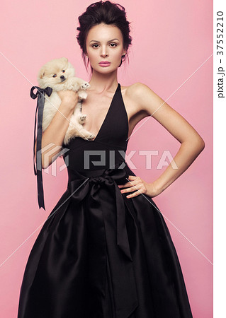 Fashion beautiful woman in black dress with bow Fashion beautiful woman in black dress with bow 37552210